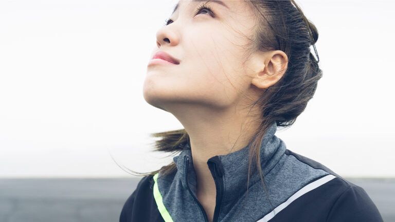 A young woman gazes heavenward