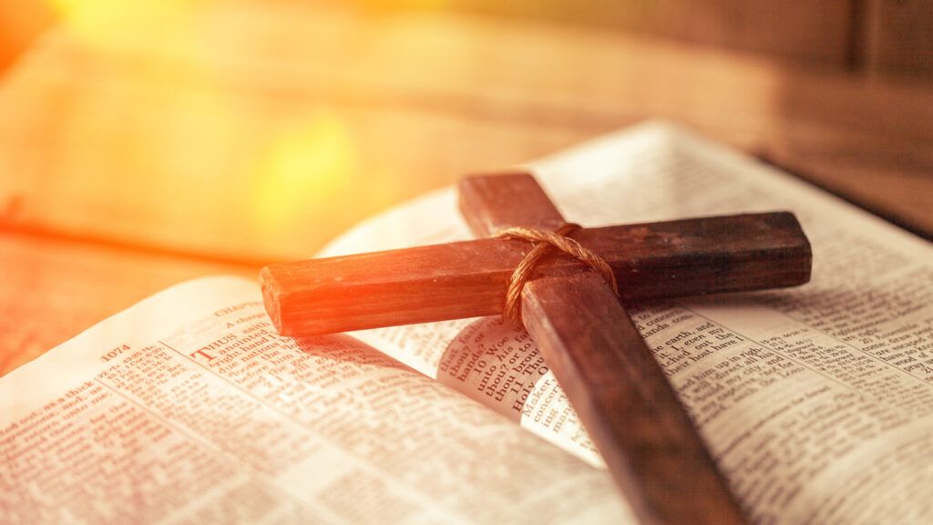 Wooden cross on a Bible; Getty Images