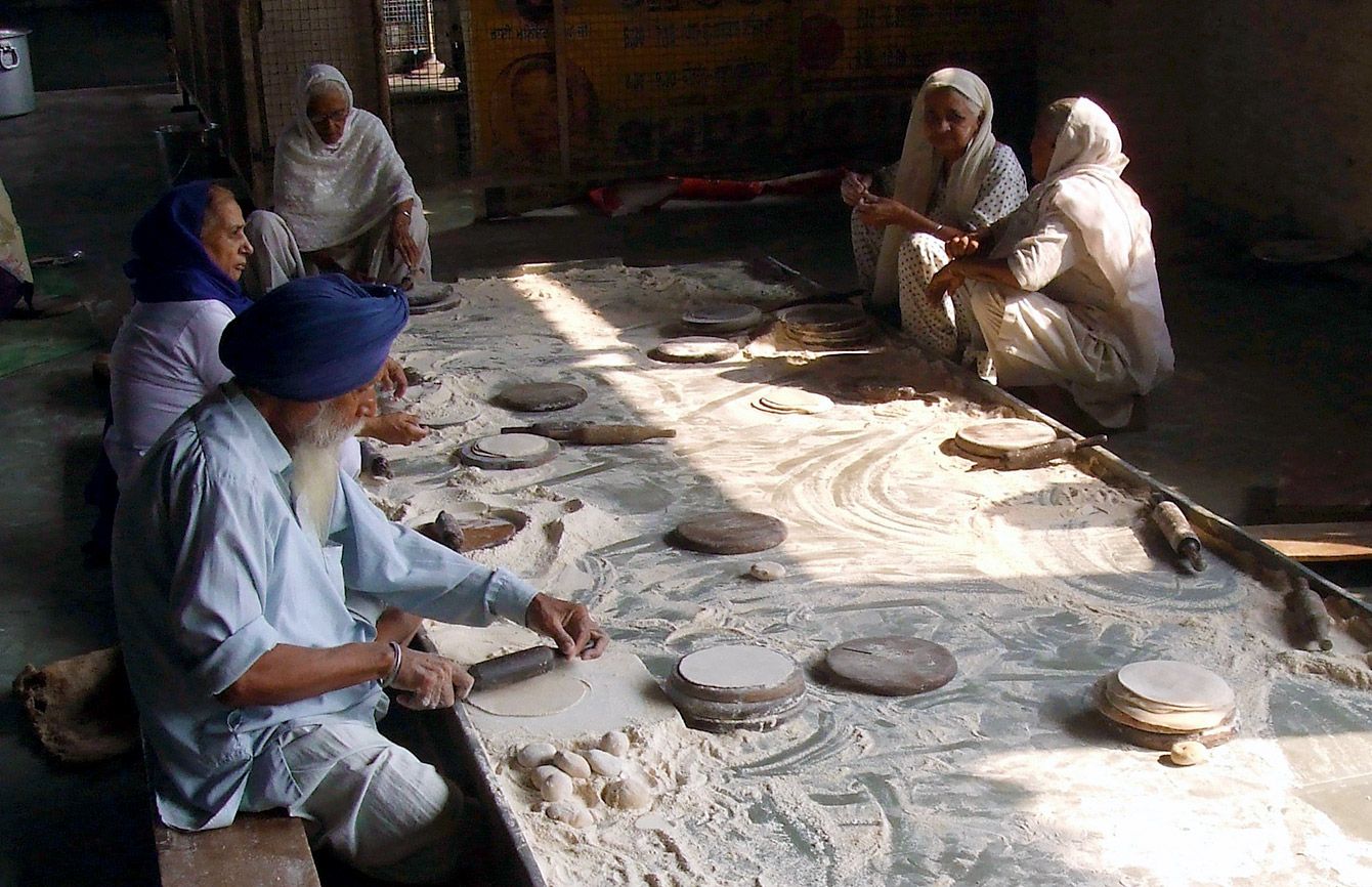 Volunteers make chapati bread in Delhi, India; photo courtesy Stephen Henderson