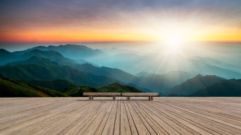 Bench on a mountain at sunrise