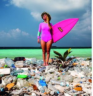 Alison standing on a polluted beach