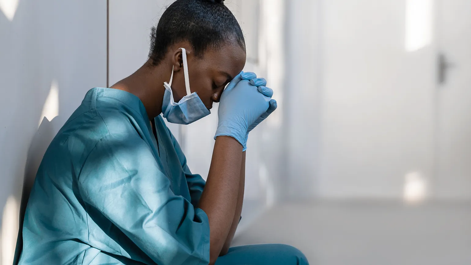 A physician praying; Getty Images