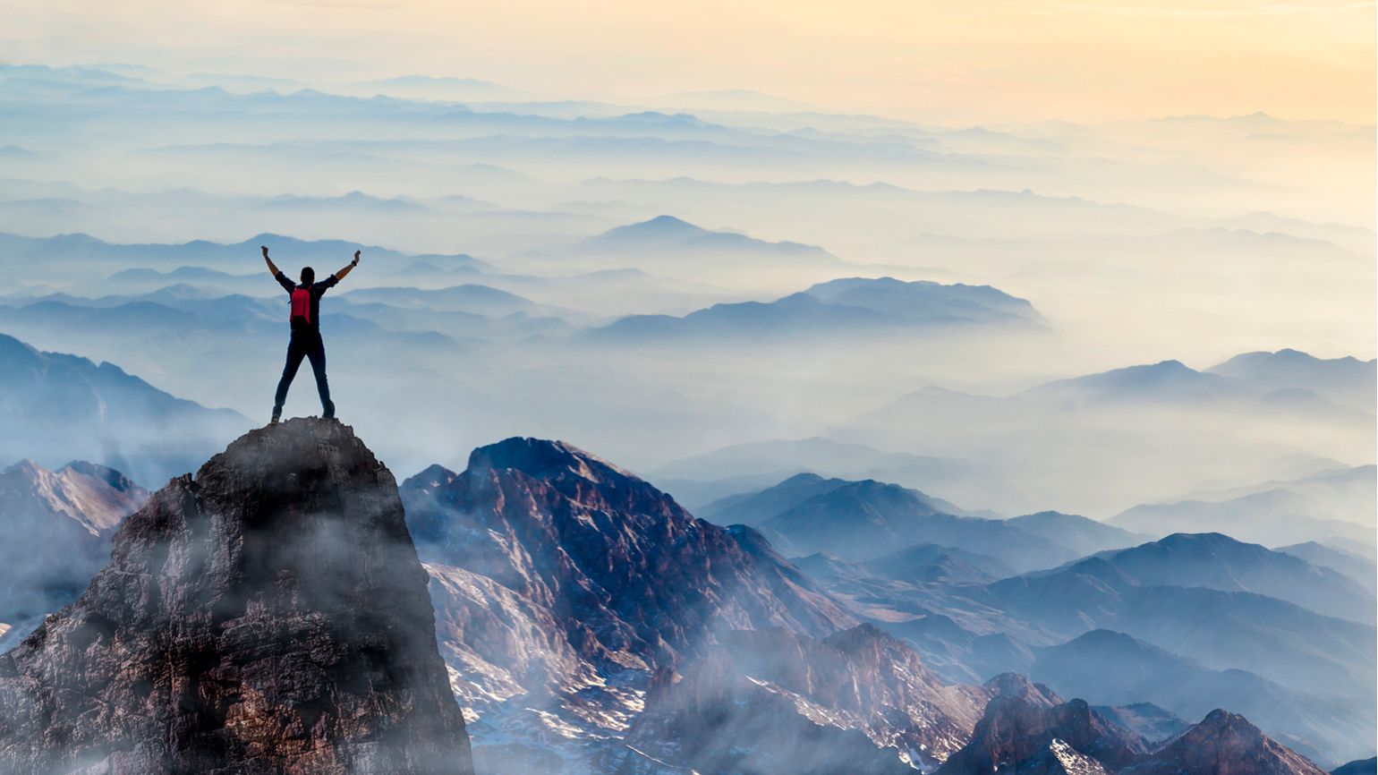 A figure on a mountaintop; Getty Images
