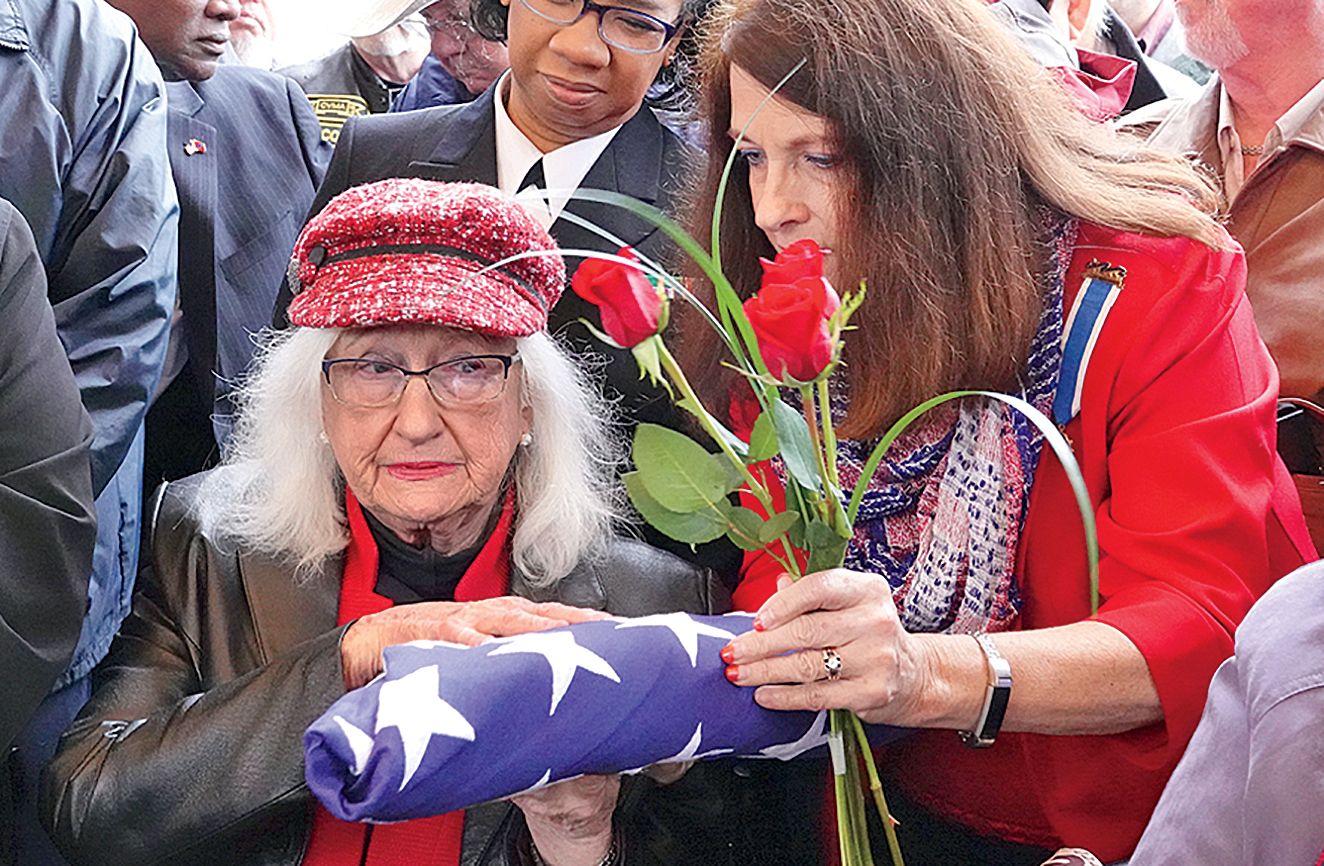 Ann Toland (left) often comes to burials; photo by Karen Pulfer Focht