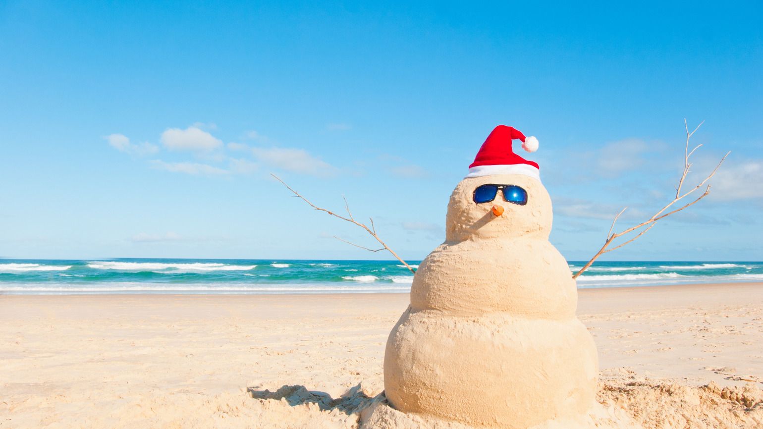 Snowman at the beach with sun glasses (Getty Images)