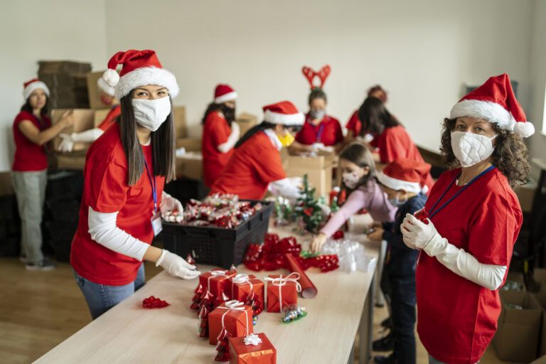Holiday community volunteers sending gifts; Getty Images