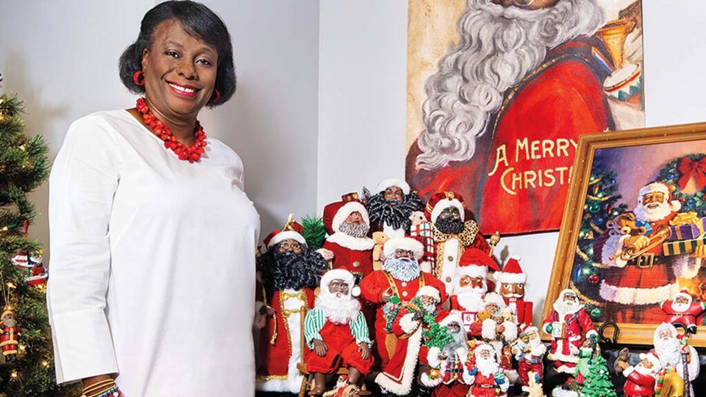 Kathy and her Santa collection; Photo credit: LAD4 CREATIONS