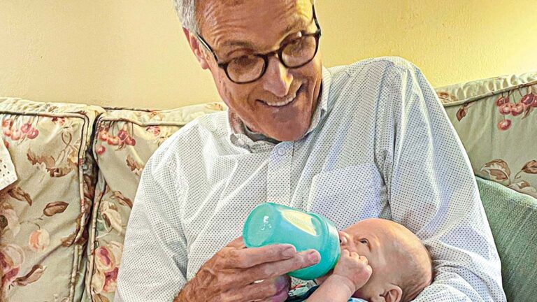 Rick Hamlin feeding baby Silas.