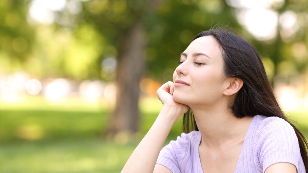 Woman resting relaxing in a park (Getty Images)