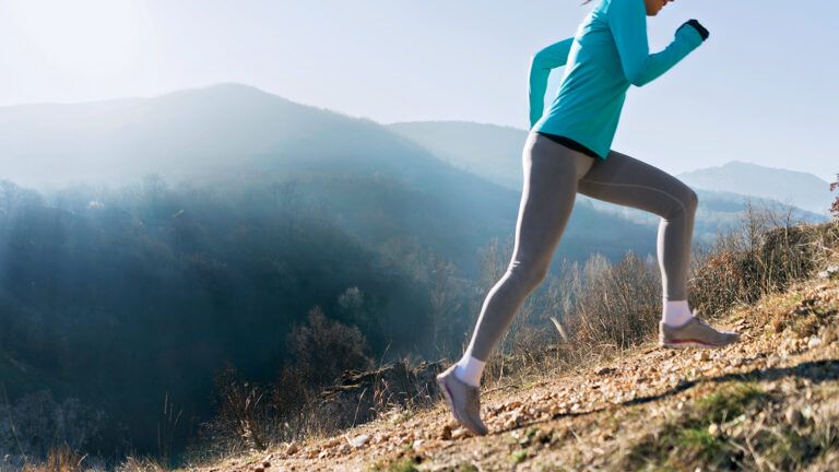 A woman running uphill; photo: Getty Images