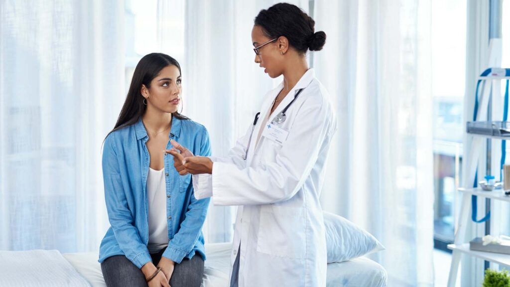 Doctor advises female patient; Getty Images