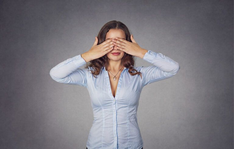 Woman covering her eyes; Getty Images