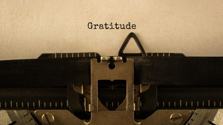 The word Gratitude, typwritten on a piece of paper