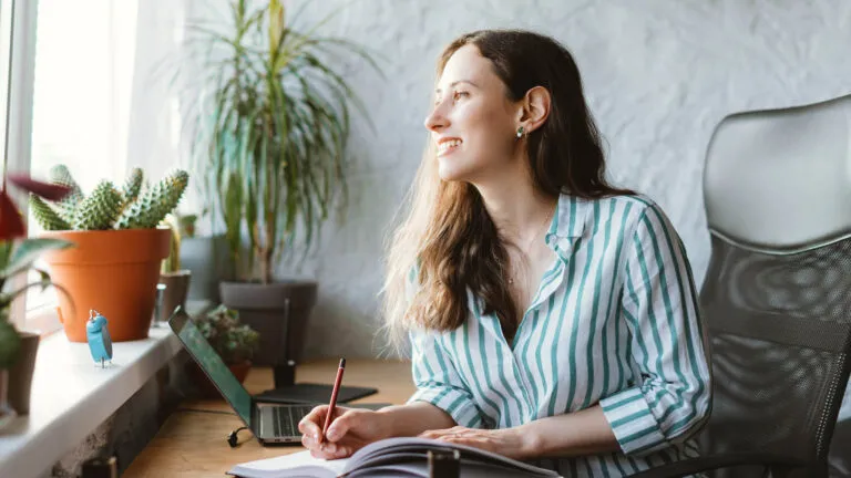 A woman caregiver writes in her journal