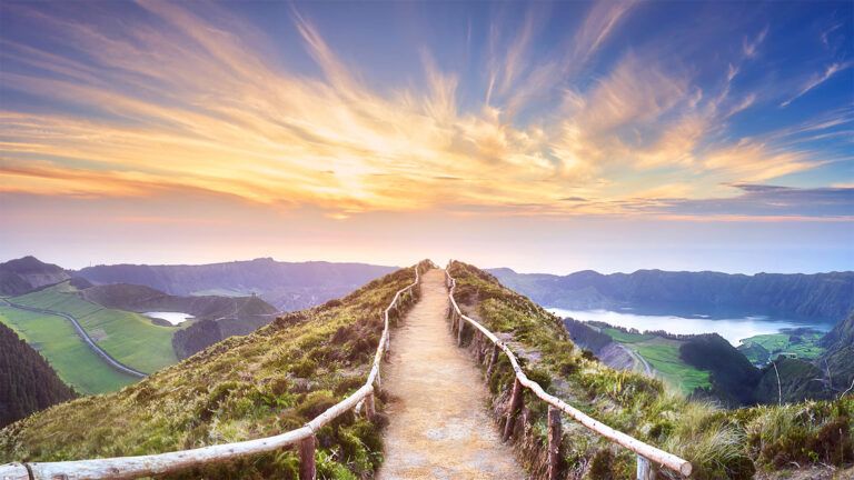 A scenic mountain path and a beautiful sunrise