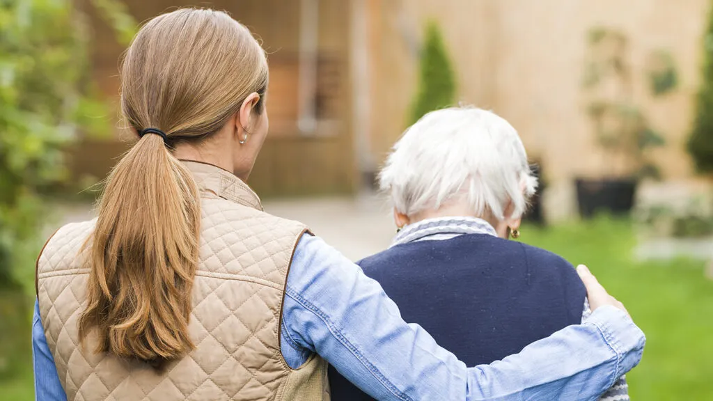 A senior woman and her adult daughter