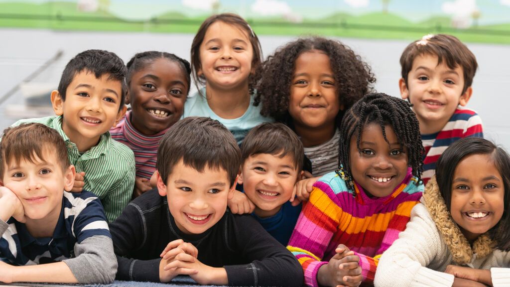 A group of diverse kids smiling