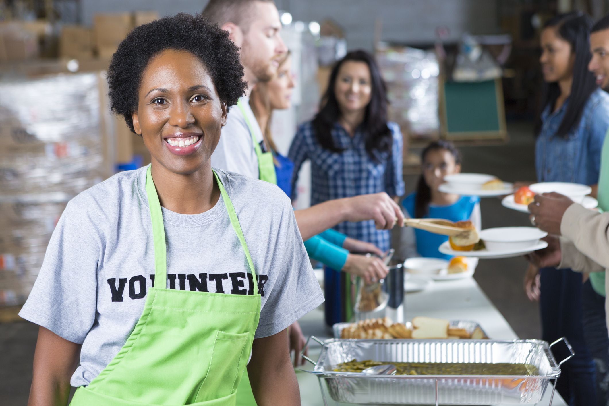 Volunteer at a soup kitchen; Getty Images
