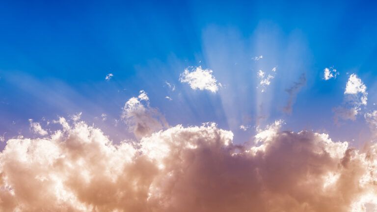 Heavenly beams among clouds