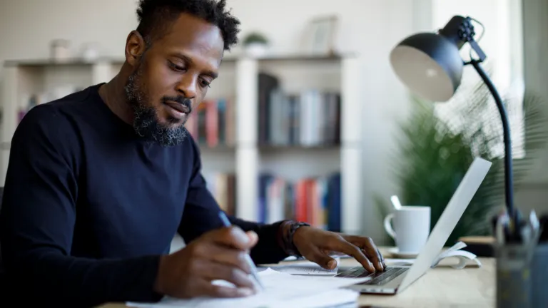 A man planning on paper; Getty Images