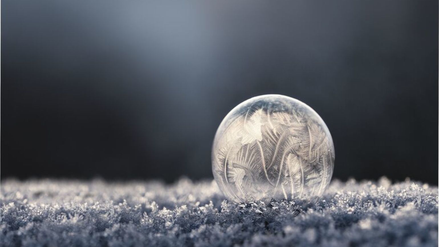 Frozen soap bubble doing positive living with an inspirational quote