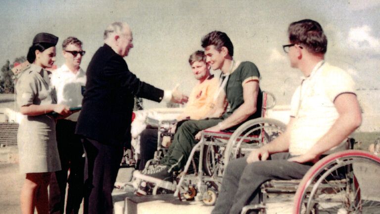 Ludwig Guttmann presents gold medal to Australian Paralympian Tony South in stories of hope
