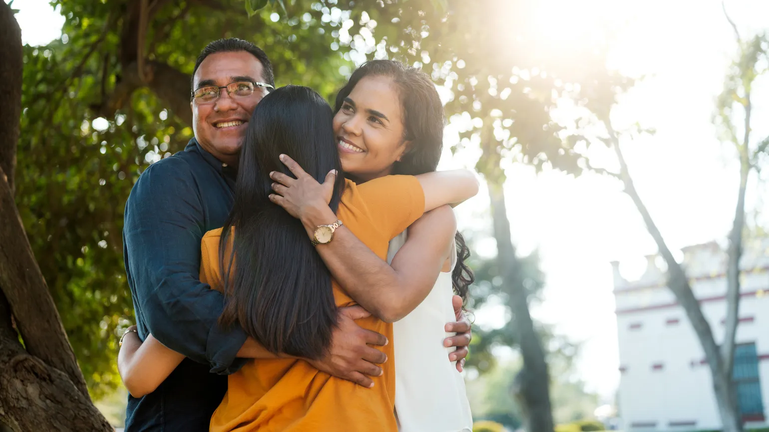 Parents hugging their daughter can be what does heaven look like