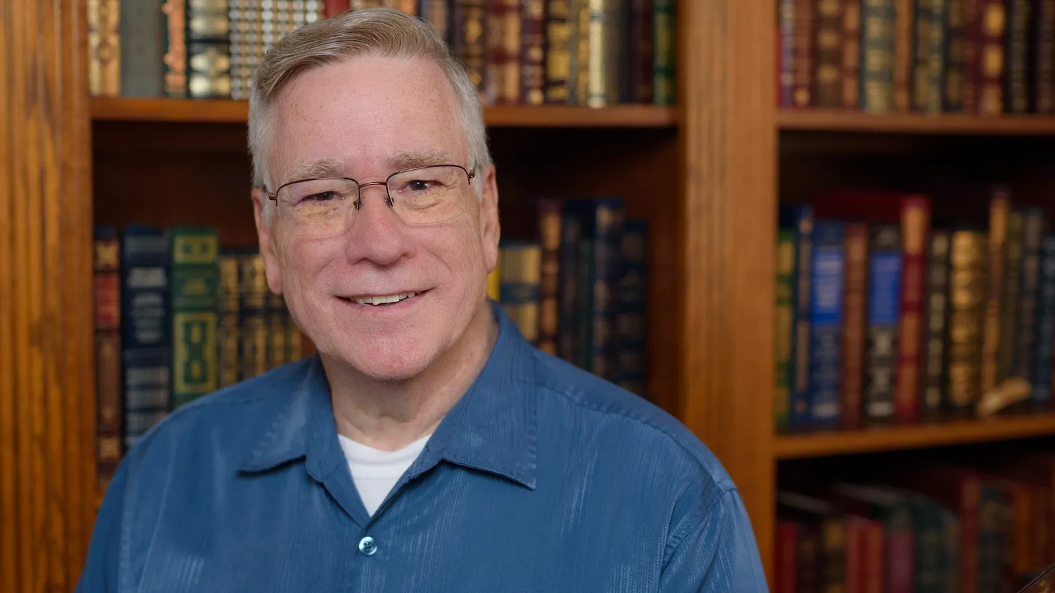 Bob Hostetler in his office sharing where to pray