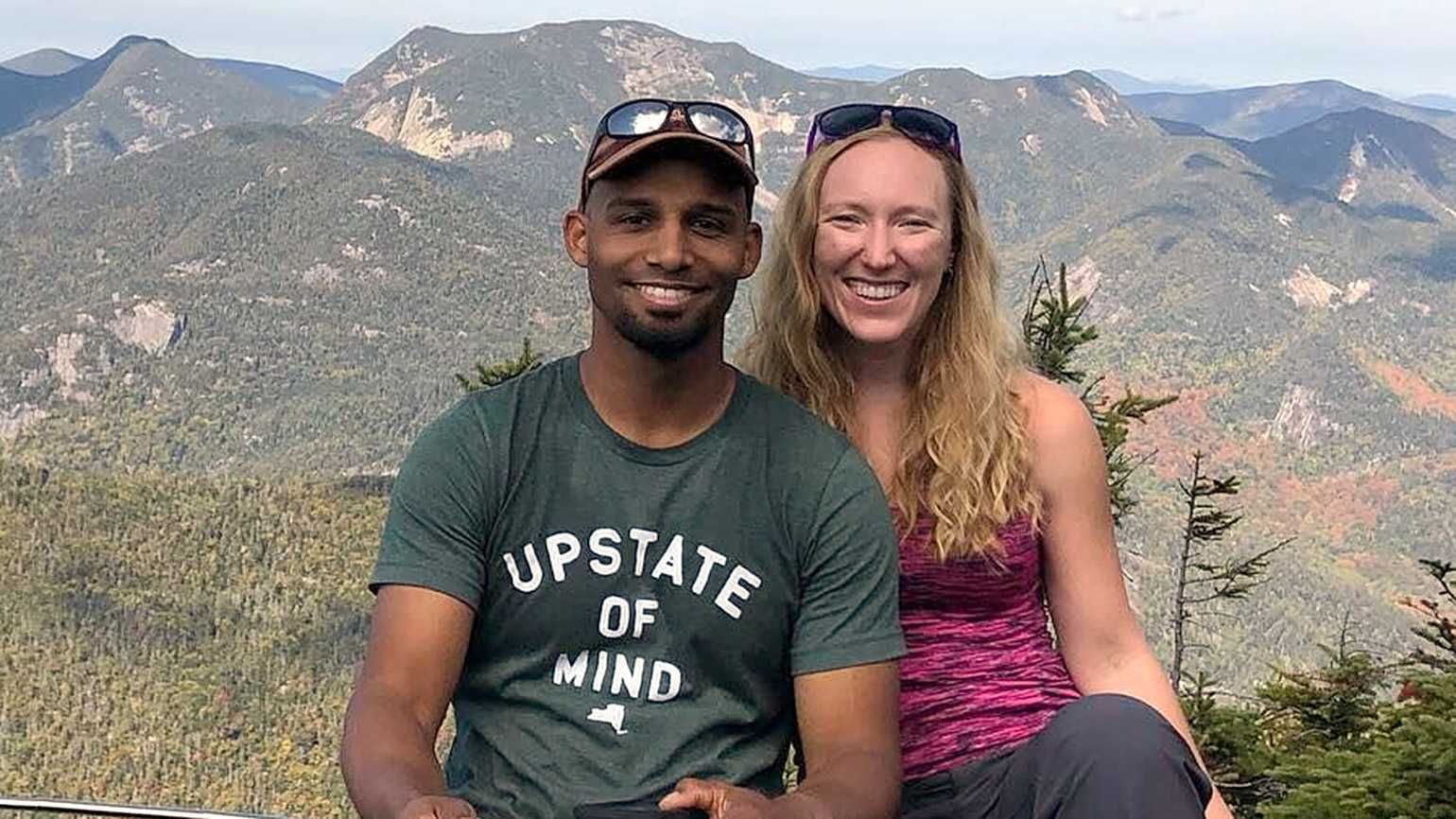 Rebecca Benjamin and her husband, Mike, on a mountaintop sharing their god encounter and story of faith