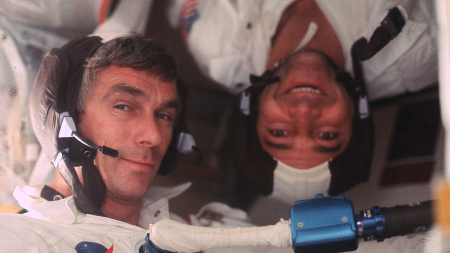 Gene Cernan and Ron Evans pose in the Command Module with inspirational quotes from NASA Astronauts