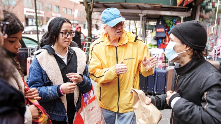 Marty Rodgers (in pale blue cap) leads a Hope Walk with student volunteers; photo by Todd Plitt