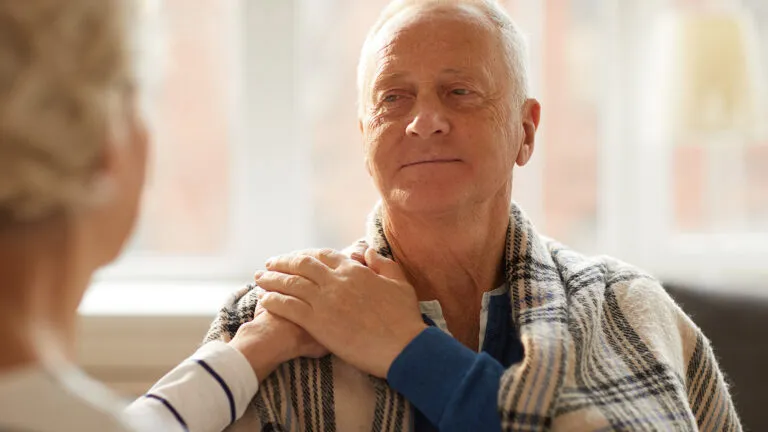 Senior man smiling at wife