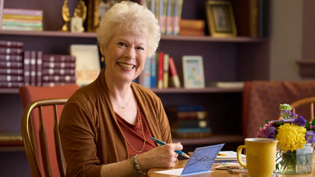 Jeanette Levellie composes a handwritten note of thanks; photo by Matthew Gilson