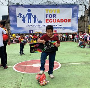 Children with Christmas gifts given to them by Toys For Ecuador; Photo Courtesy Toys for Ecuador