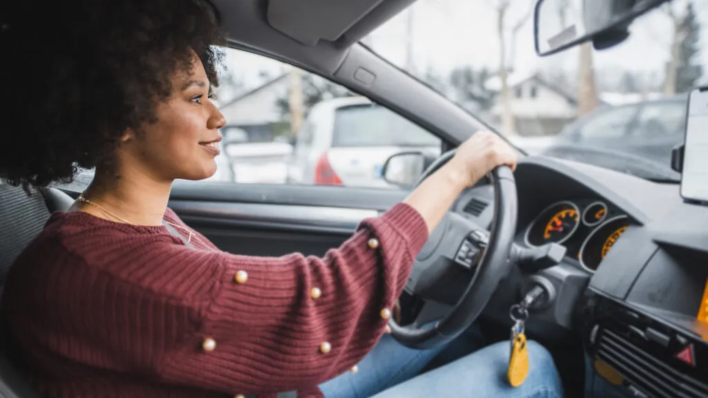 Busy mom driving a car