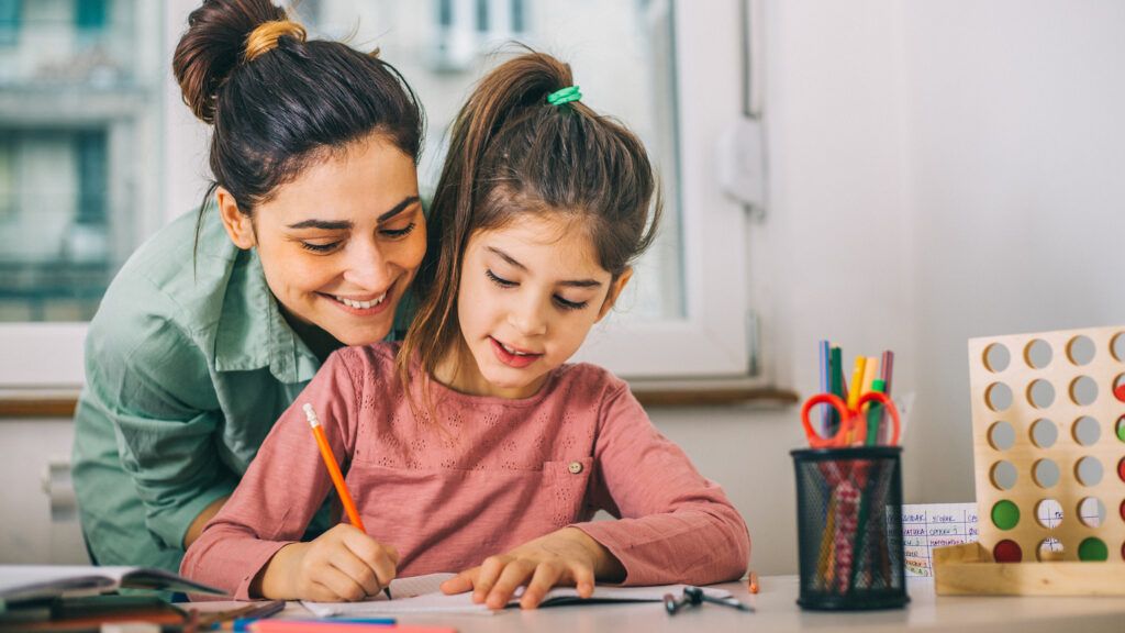 Mom helping daughter with homework