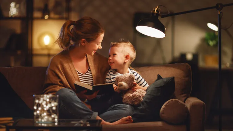 Mother and son reading a bedtime story as a habit