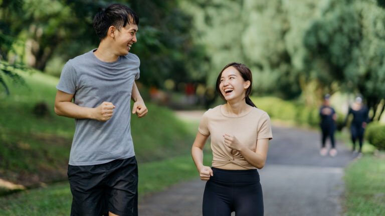 Young couple exercising together for their bible habits