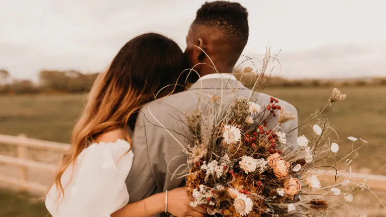 A bride and groom from behind as they discuss what the Bible says about marriage