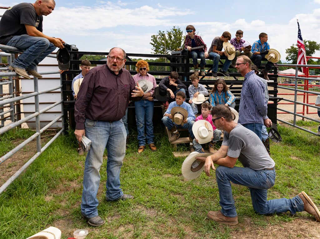 Scott Hilgendork ministers to rodeo cowboys; photo by Wade Payne
