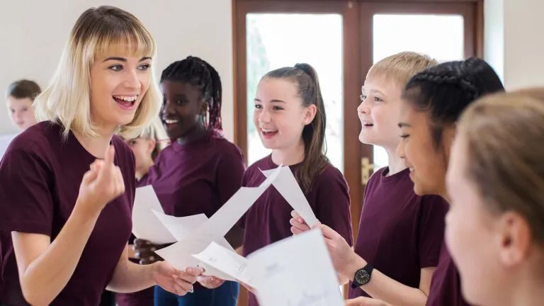 Children and music teacher singing lent hymns together