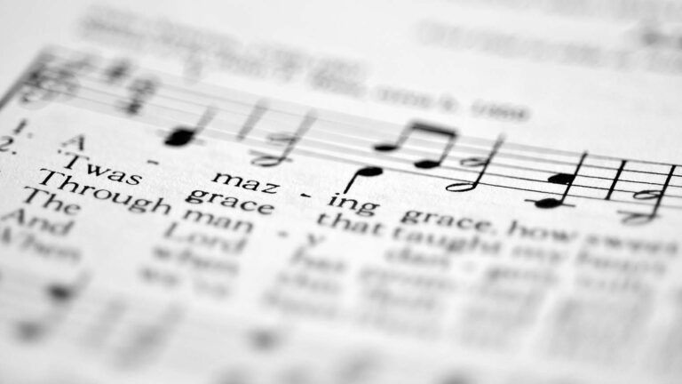 Close up on sheet music for the lent hymn amazing grace