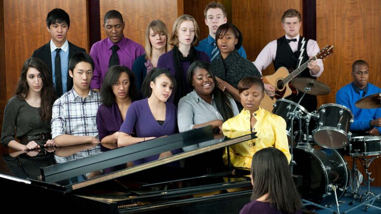 Group of young people singing lent hymns with a piano and drum set
