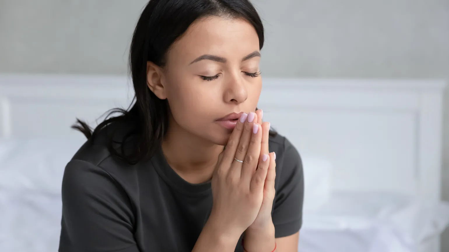 woman praying about the meaning of lent in her home