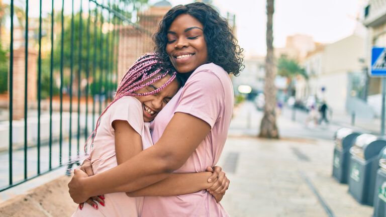 Mom and teenage daughter hugging as they celebrate lent for teens