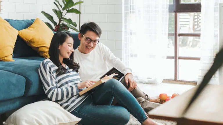 young couple reading bible verses about love together