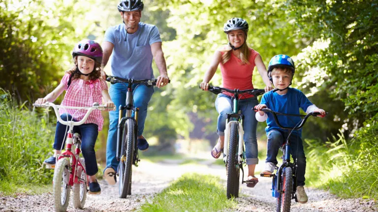 Family biking and celebrating spring as the most positive season