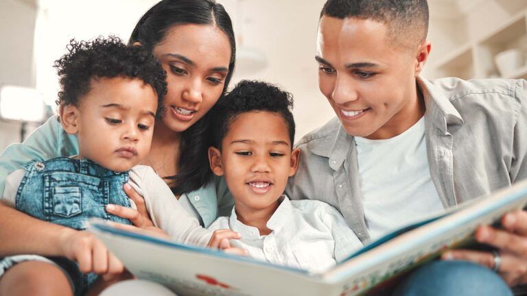 Family reading a book together for their family lent activity