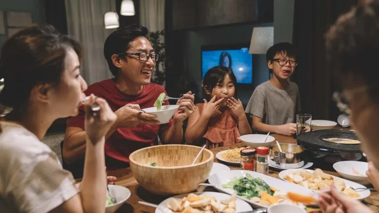 Happy family having dinner together for their family lent activity