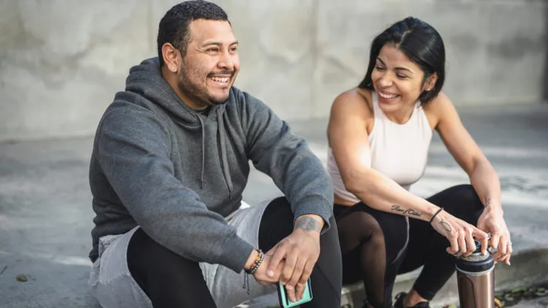 Two friends, man and woman, talking to each other